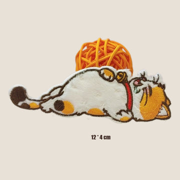 drooling calico cat on its back with red collar embroidered patch
