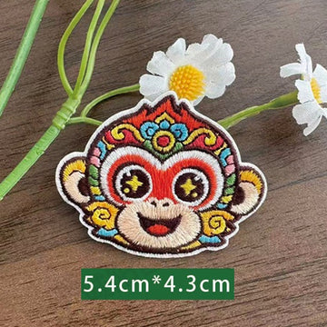 Chinese zodiac monkey embroidered stick-on patch — red face wide grin colorful opera crown star pupils