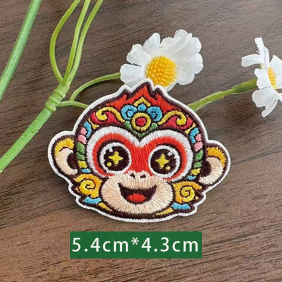 Chinese zodiac monkey embroidered stick-on patch — red face wide grin colorful opera crown star pupils