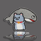 blue gray cat buried under big fish with red collar embroidered patch