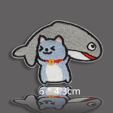 blue gray cat buried under big fish with red collar embroidered patch