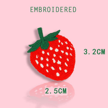 small red strawberry embroidered stick-on patch — vivid red embroidery with white seed dots and green leaf top compact accent size 25x32mm