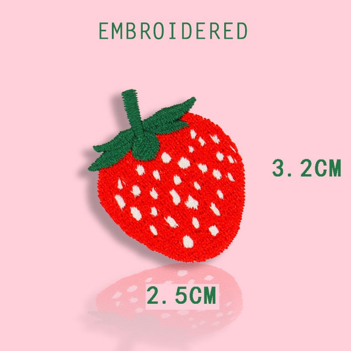 small red strawberry embroidered stick-on patch — vivid red embroidery with white seed dots and green leaf top compact accent size 25x32mm