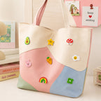 avocado star mushroom bunny carrot egg rainbow and clover mini icon stick-on patches scattered on a pink blue and mint color-block leather handbag