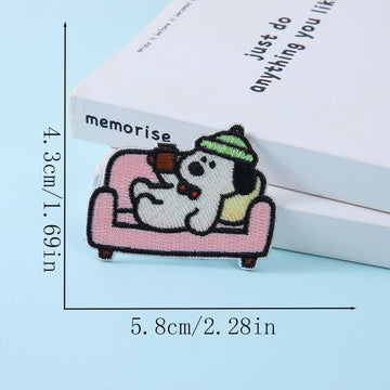 dog relaxing on pink sofa with green beanie embroidered stick-on patch