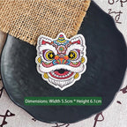 pink floral Chinese lion dance embroidered stick-on patch — soft purple pink face with crescent blue eyes floral geometric forehead motifs round dreamy silhouette