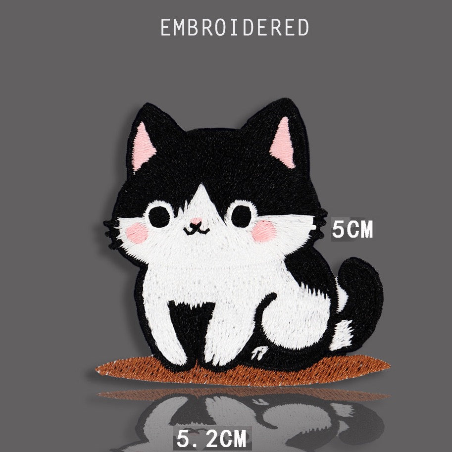 sitting tuxedo cat with round eyes embroidered stick-on patch