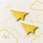 yellow paper airplane embroidered stick-on patches — pair of bright yellow satin embroidery paper planes with deep yellow fold crease detail 33x18mm