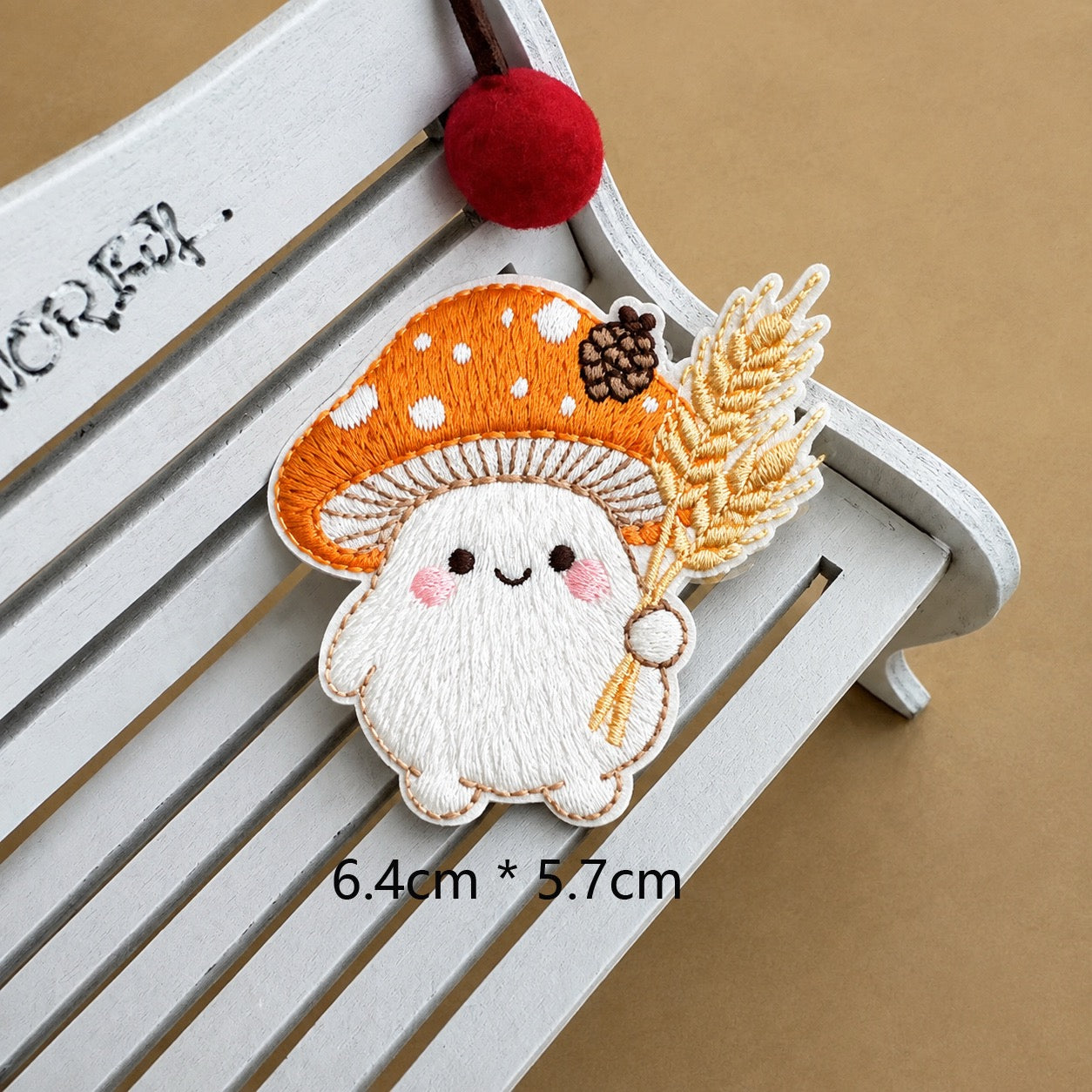 autumn wheat mushroom baby embroidered stick-on patch — orange spotted cap with pine cone holding wheat stalk