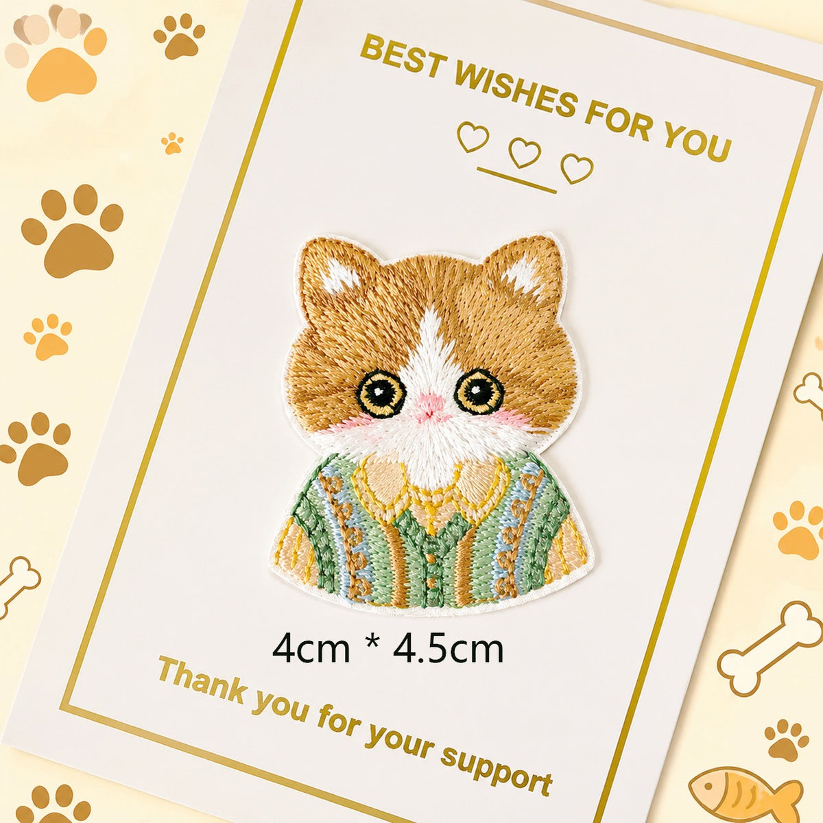 orange tabby in green sweater embroidered stick-on patch — green pastoral sweater with cloud and tree detail