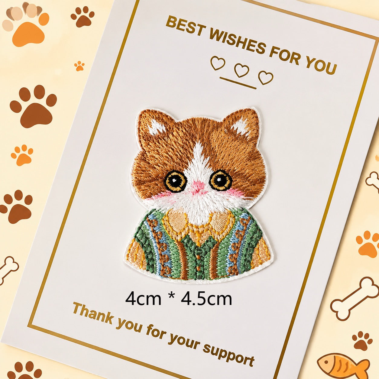 orange tabby in green sweater embroidered stick-on patch — green pastoral sweater with cloud and tree detail