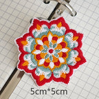 Eight-point floral embroidered stick-on patch with red and white petals
