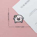 Pink piglet embroidered stick-on patch with a tiny yellow star beside its ear
