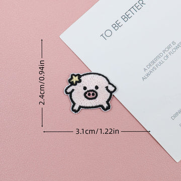 Pink piglet embroidered stick-on patch with a tiny yellow star beside its ear
