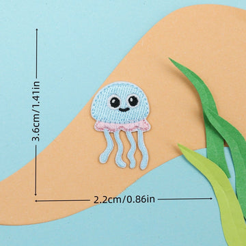blue jellyfish embroidered stick-on patch — soft dome with pink tentacles and big eyes