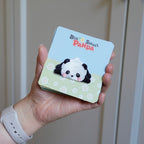 holding an adorable giant panda embroidered stick-on patch in hand