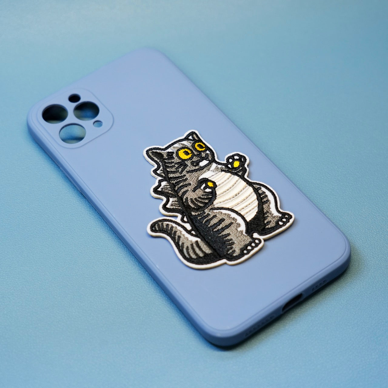 cat godzilla stick-on patch on a phone case