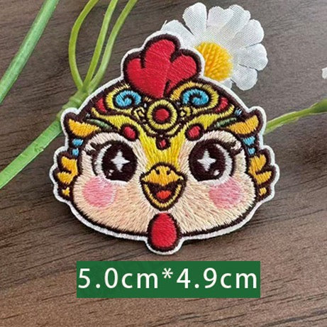 Chinese zodiac rooster embroidered stick-on patch — bright red comb yellow feather framing festive opera face-paint style