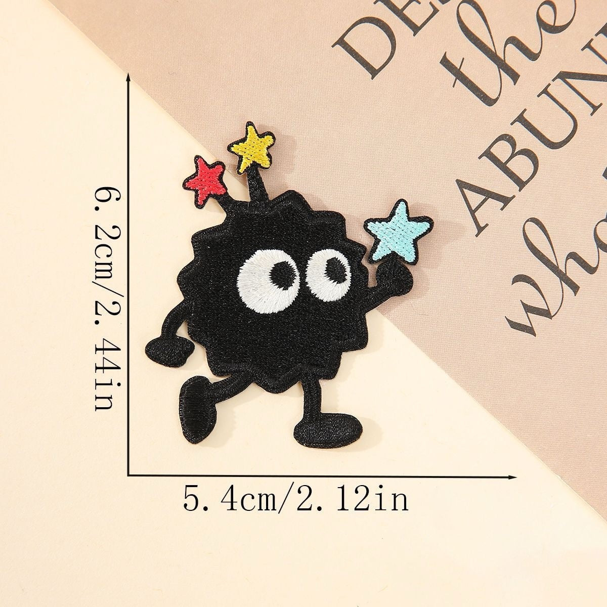 running soot sprite embroidered patch with three colorful stars