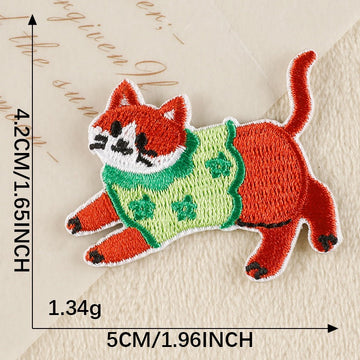 active ginger cat in green floral knit whimsical embroidered stick-on patch
