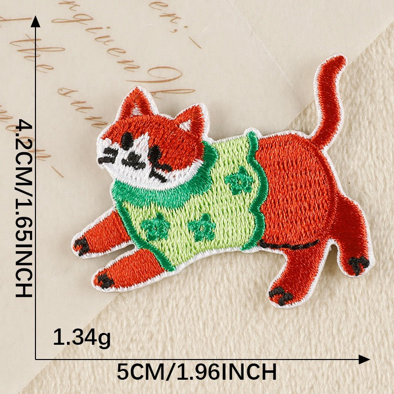 active ginger cat in green floral knit whimsical embroidered stick-on patch
