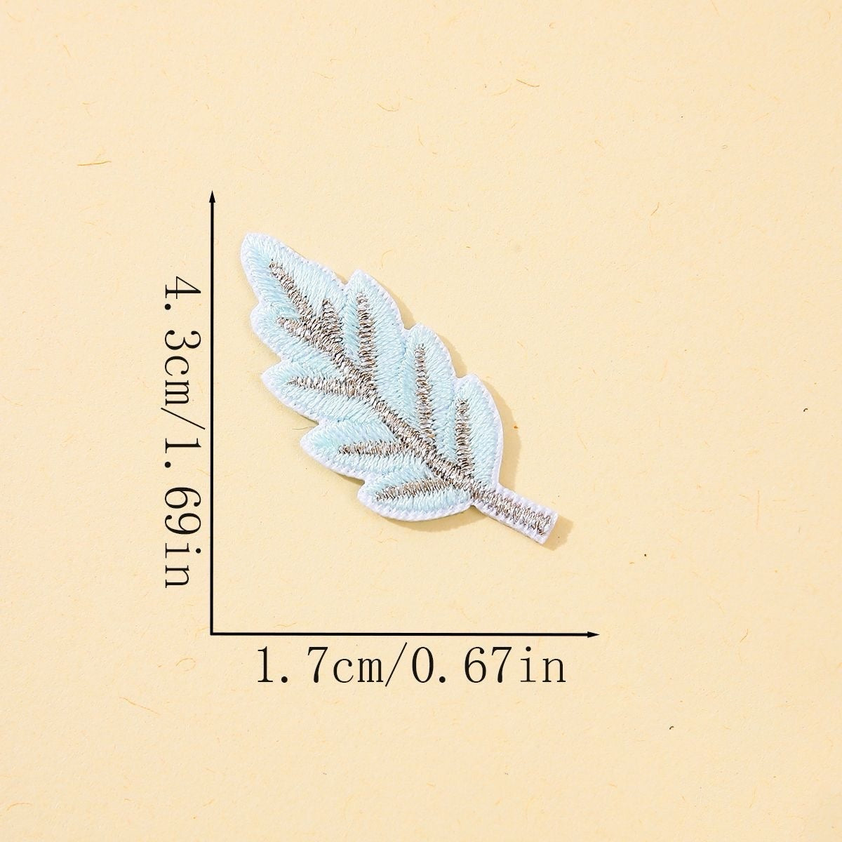 sky blue leaf embroidered stick-on patch with silver metallic vein detail
