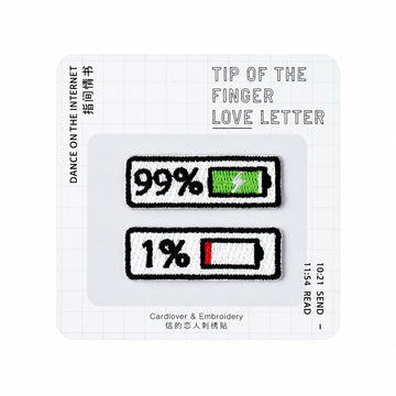 99% and 1% battery level embroidered stick-on patches — green full and red low battery pair