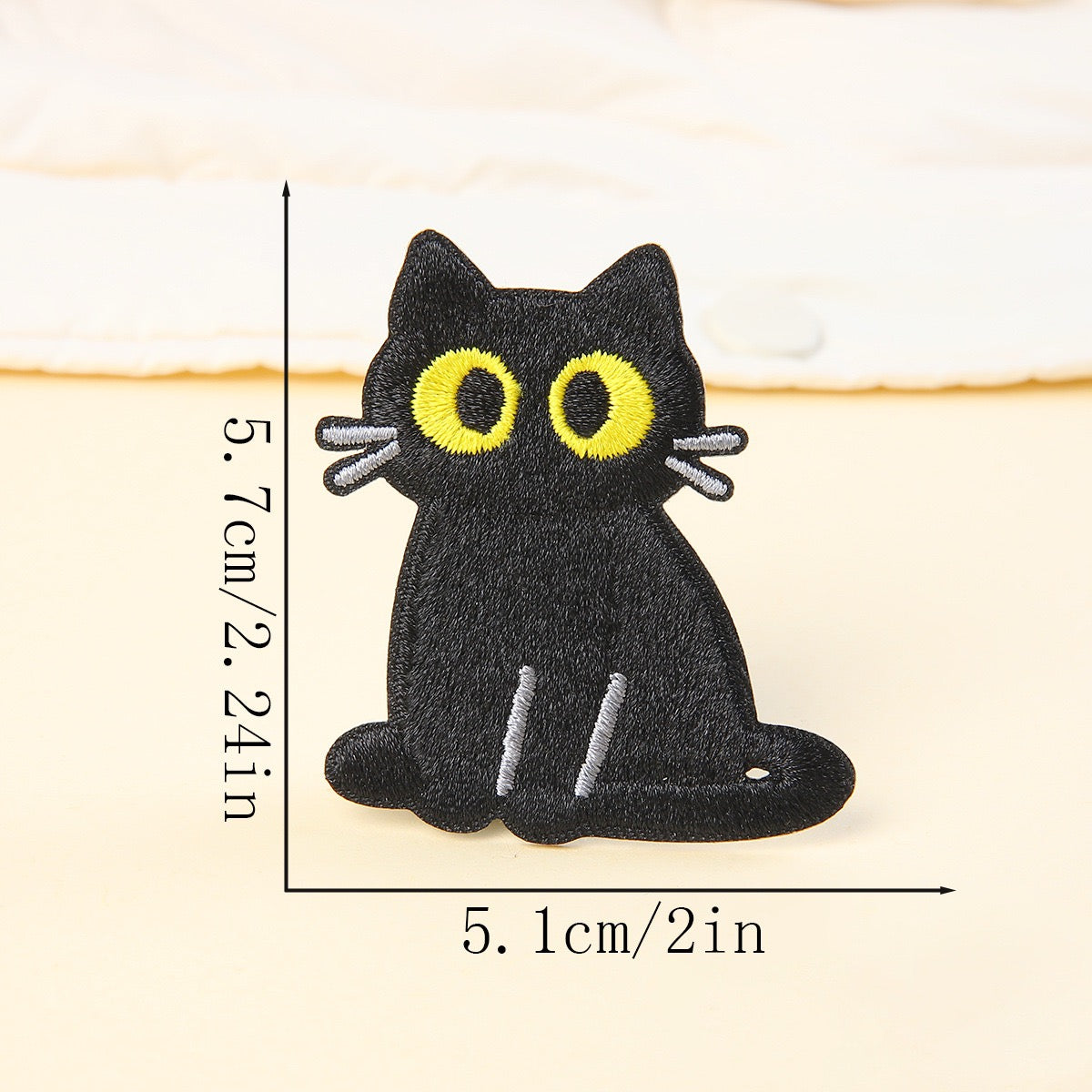 sitting upright black cat embroidered stick-on patch — large yellow-green eyes