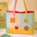 chenille waffle sandwich fries and cookie with smiley faces stick-on patches decorating a multicolor stripe leather handbag