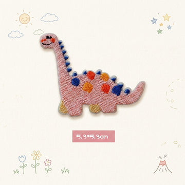 pink Brachiosaurus kawaii embroidered stick-on patch — pink long-neck dinosaur side view with blue and orange spots serene expression