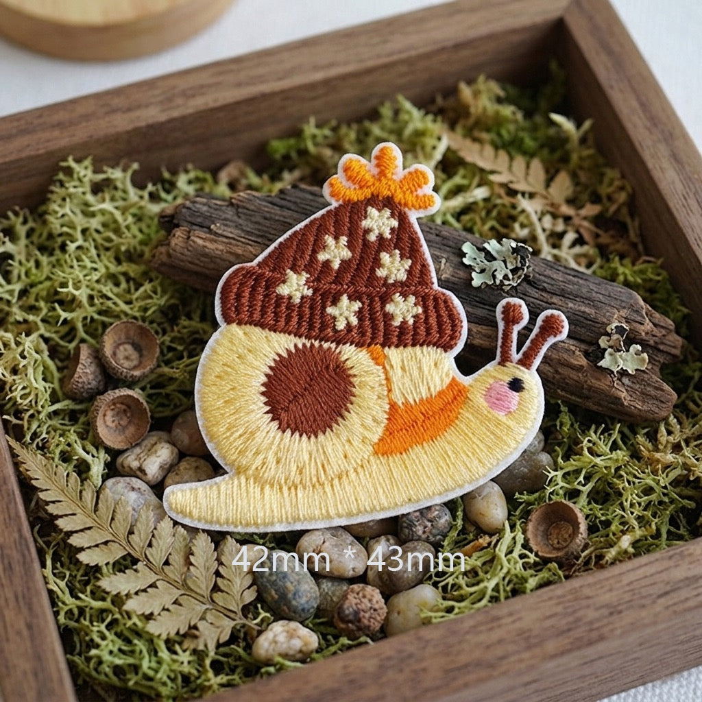 yellow snail with brown acorn hat cottagecore embroidered stick-on patch