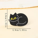 curled up loafing black cat embroidered stick-on patch — tucked into itself