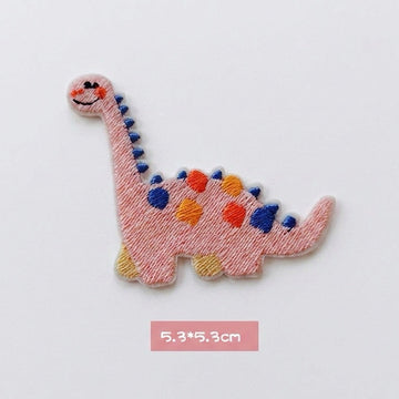 pink Brachiosaurus kawaii embroidered stick-on patch — pink long-neck dinosaur side view with blue and orange spots serene expression