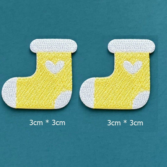 yellow heart stocking embroidered stick-on patches — pair of bright yellow stockings with white cuff white heart motif and white toe 30x30mm