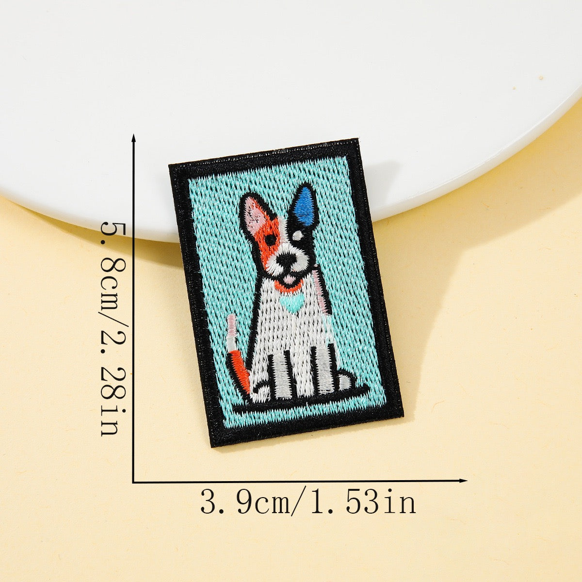 split color terrier retro pop art embroidered stick-on patch on blue background