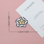 Smiling yellow star embroidered stick-on patch surrounded by a white cloud-like outline
