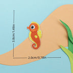 orange seahorse embroidered stick-on patch — curled tail with yellow spots
