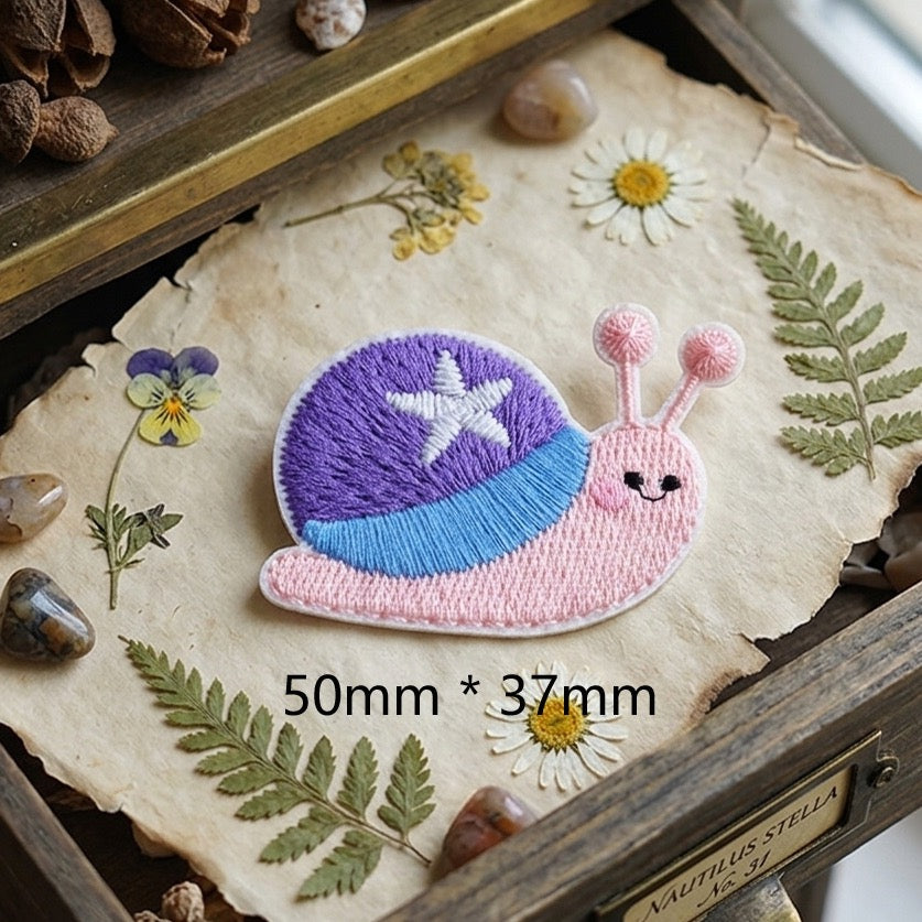 pink snail with purple star shell cottagecore embroidered stick-on patch