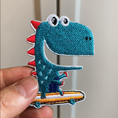 animated hand holding packaged cute cartoon dinosaur embroidered patches showing four styles and detailed embroidery texture
