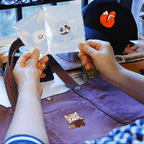 showing how to apply a fluffy cloud embroidered stick-on patch