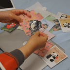 animated peeling and applying a cat godzilla embroidered stick-on patch