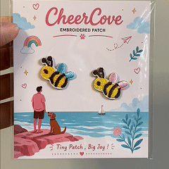 animated hand holding packaged bee embroidered patches showing detailed embroidery texture