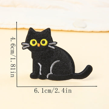 side sitting black cat embroidered stick-on patch — tail curled around feet