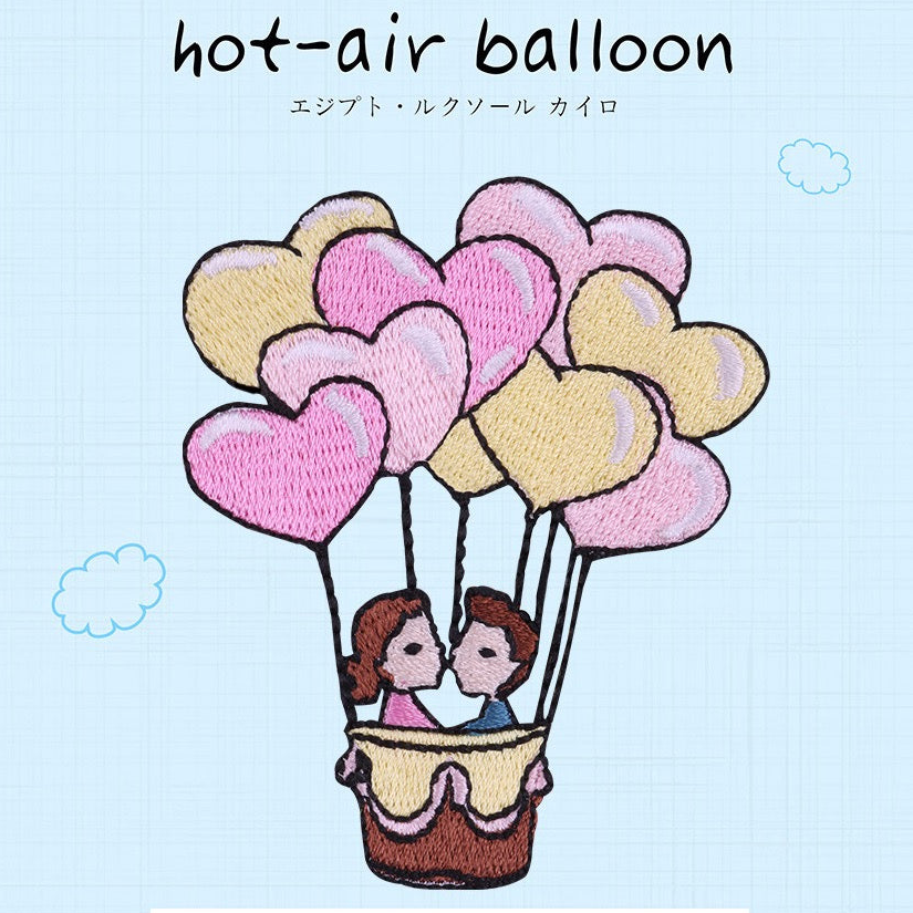 colorful vintage hot air balloon embroidered stick-on patches — seven designs including rainbow chevron pastel quilt spiral stripe heart-shaped and kissing couple balloons