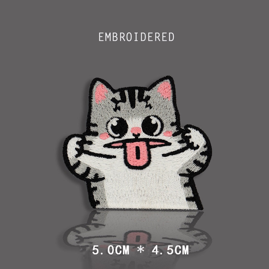 tabby cat making a silly face embroidered stick-on patch