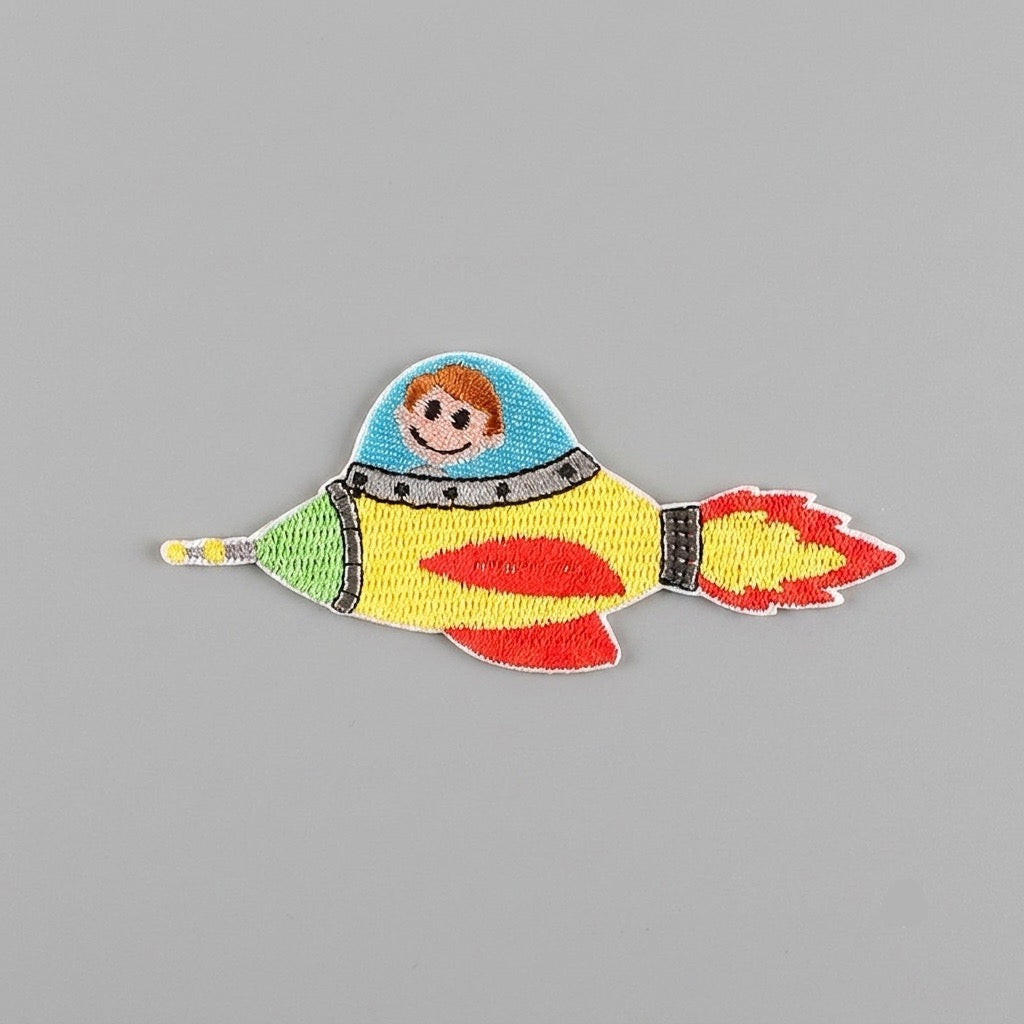 astronaut and space embroidered stick-on patches in eight designs — boy girl astronaut rockets waving and spacewalking astronauts