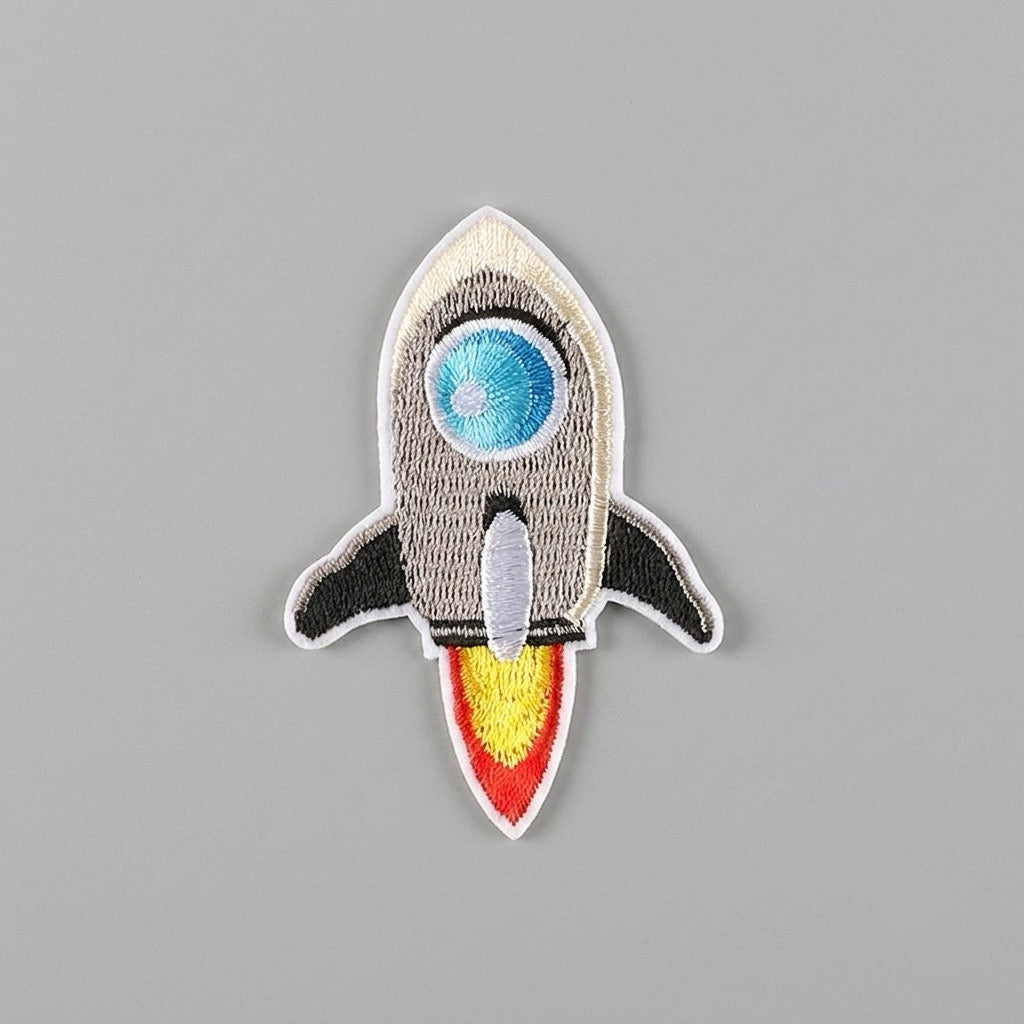 cartoon rocket embroidered stick-on patches in nine designs — retro kawaii and sci-fi styles