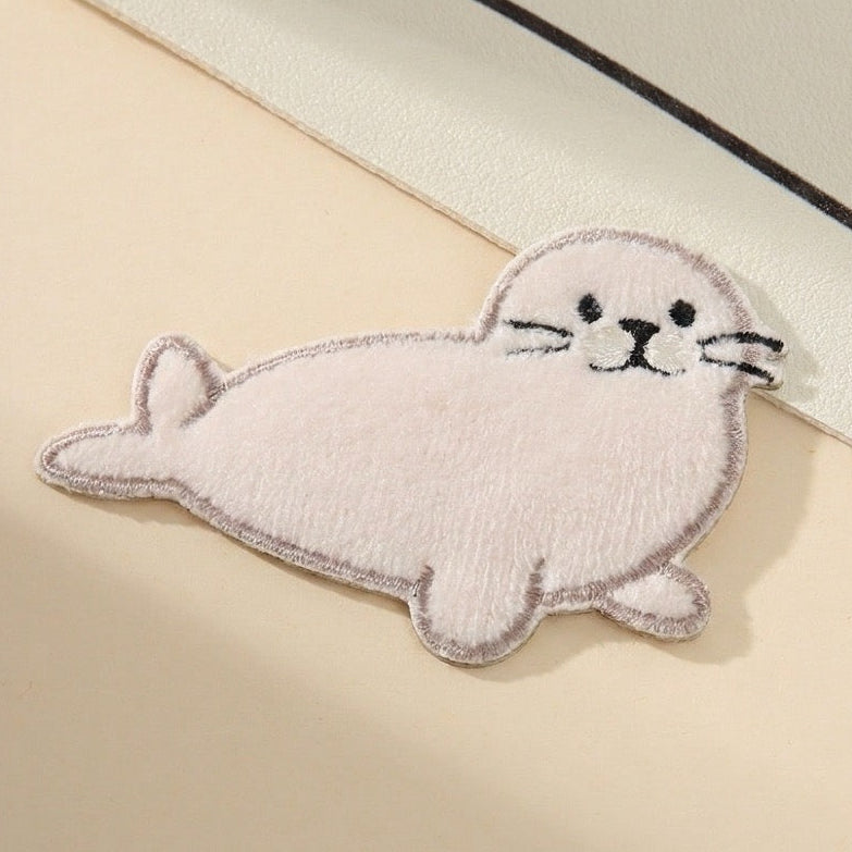 snow white harp seal fluffy embroidered patch close-up detail