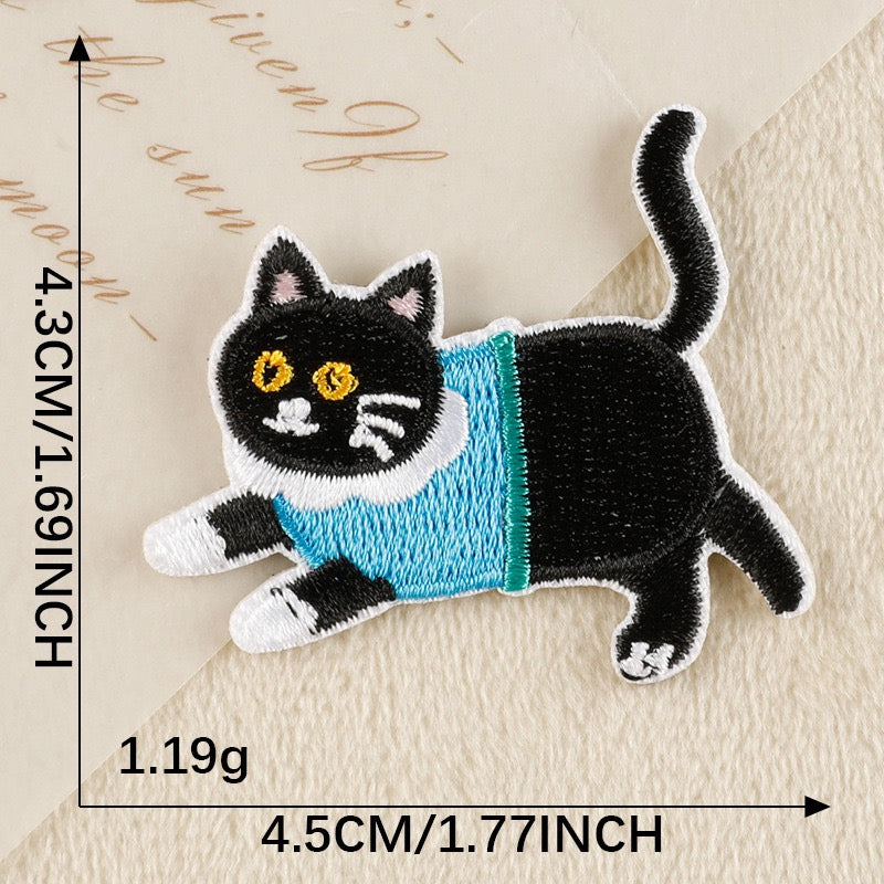 dashing tuxedo cat in blue turtleneck whimsical embroidered stick-on patch