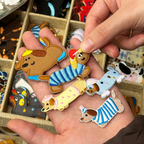 funny dachshund fashion show stick-on embroidered patches held in hand